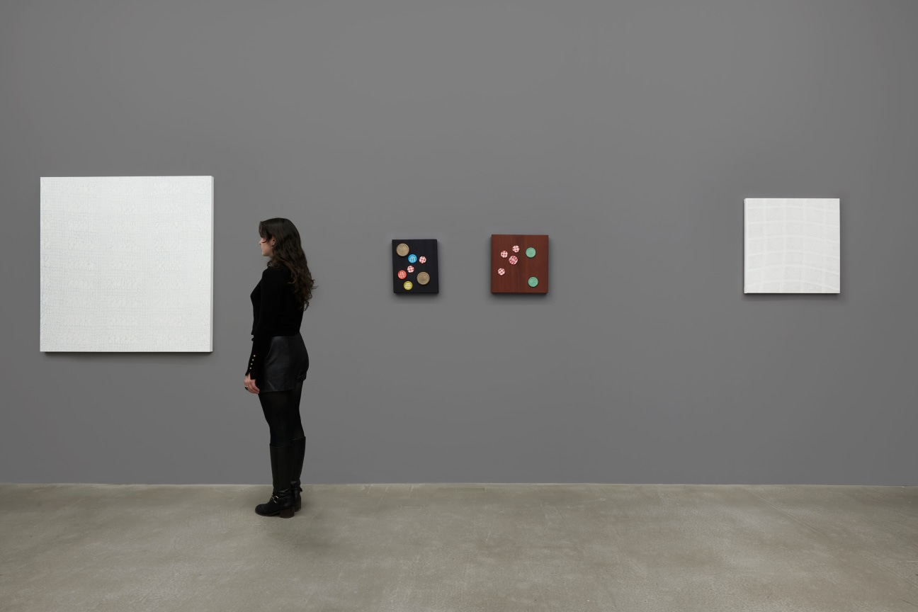 person observing a white artwork