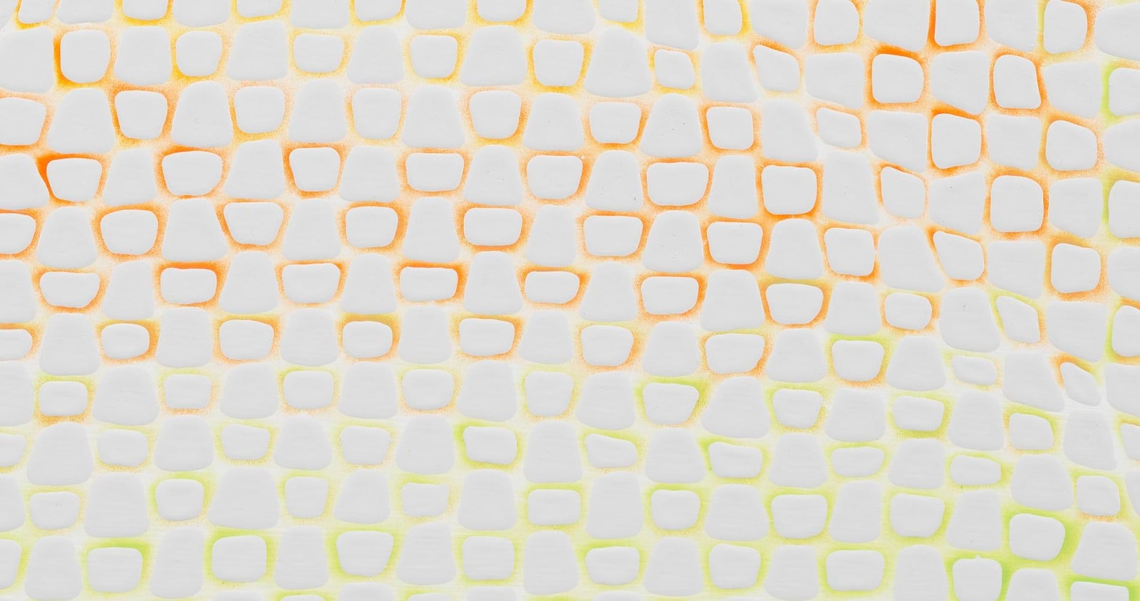 close up of circular pattern with yellow and orange tint