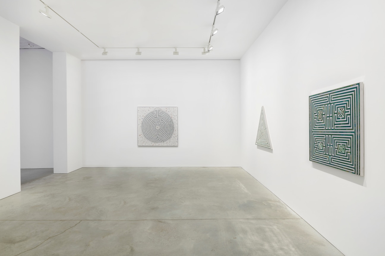 view of three artworks within a gallery