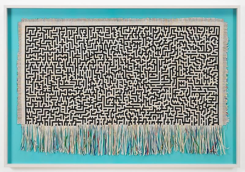 Paper woven together to create a rug-like object by SIMON EVANS&trade;.