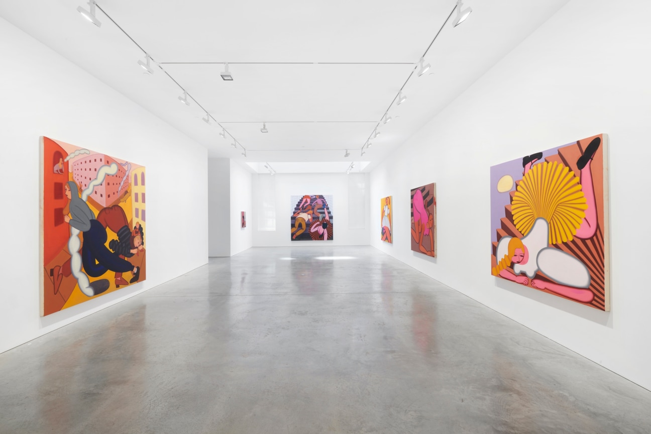 view of a long gallery with several paintings