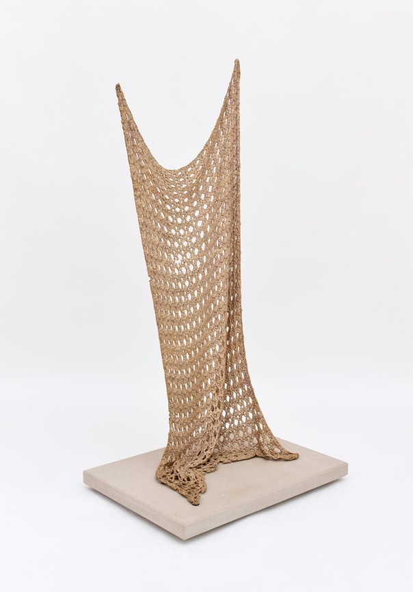 bronze sculpture made to look like a knitted quilt