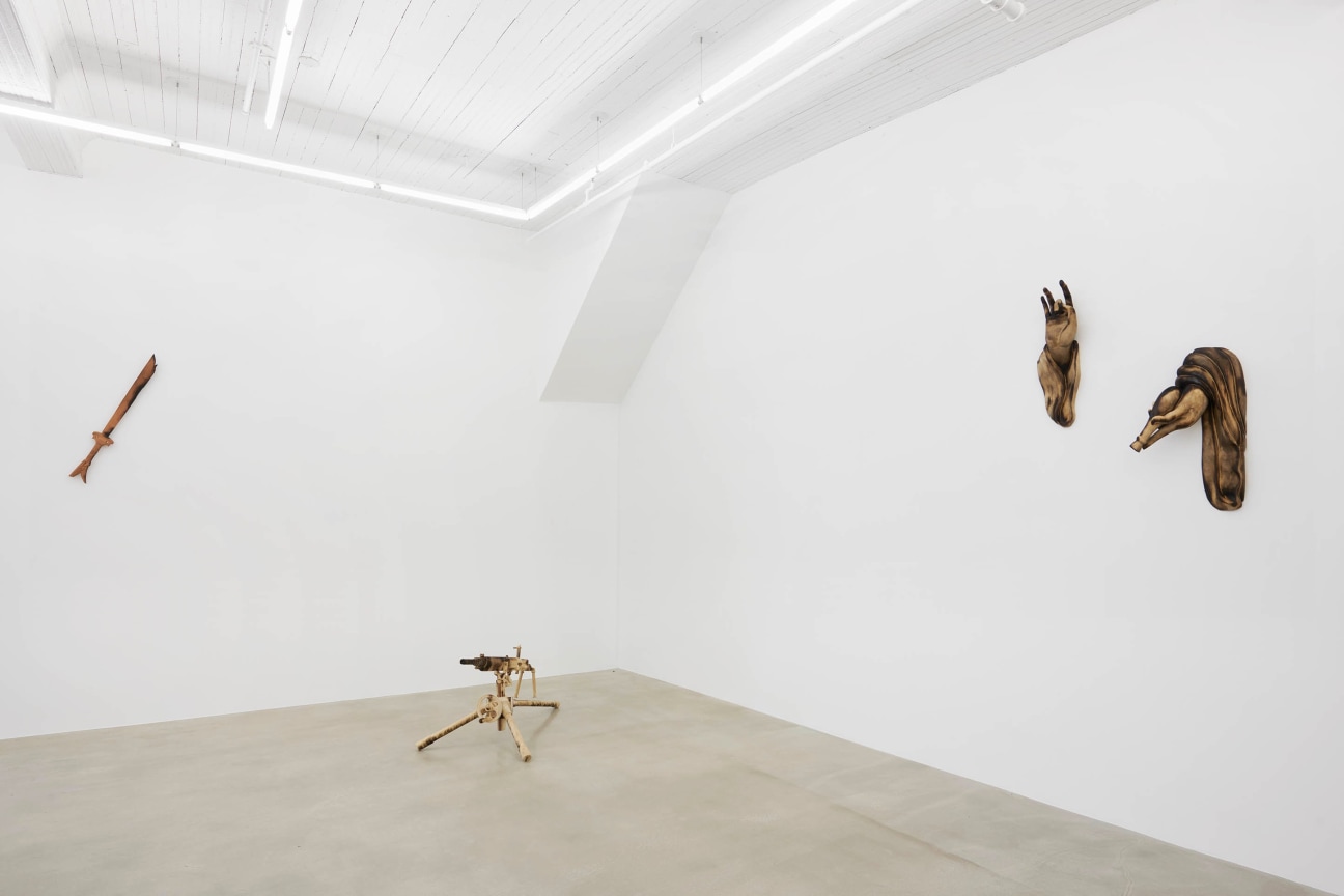 view of Tuan Andrew Nguyen's &quot;A Lotus in a Sea of Fire&quot; exhibition focusing on three wooden sculptures