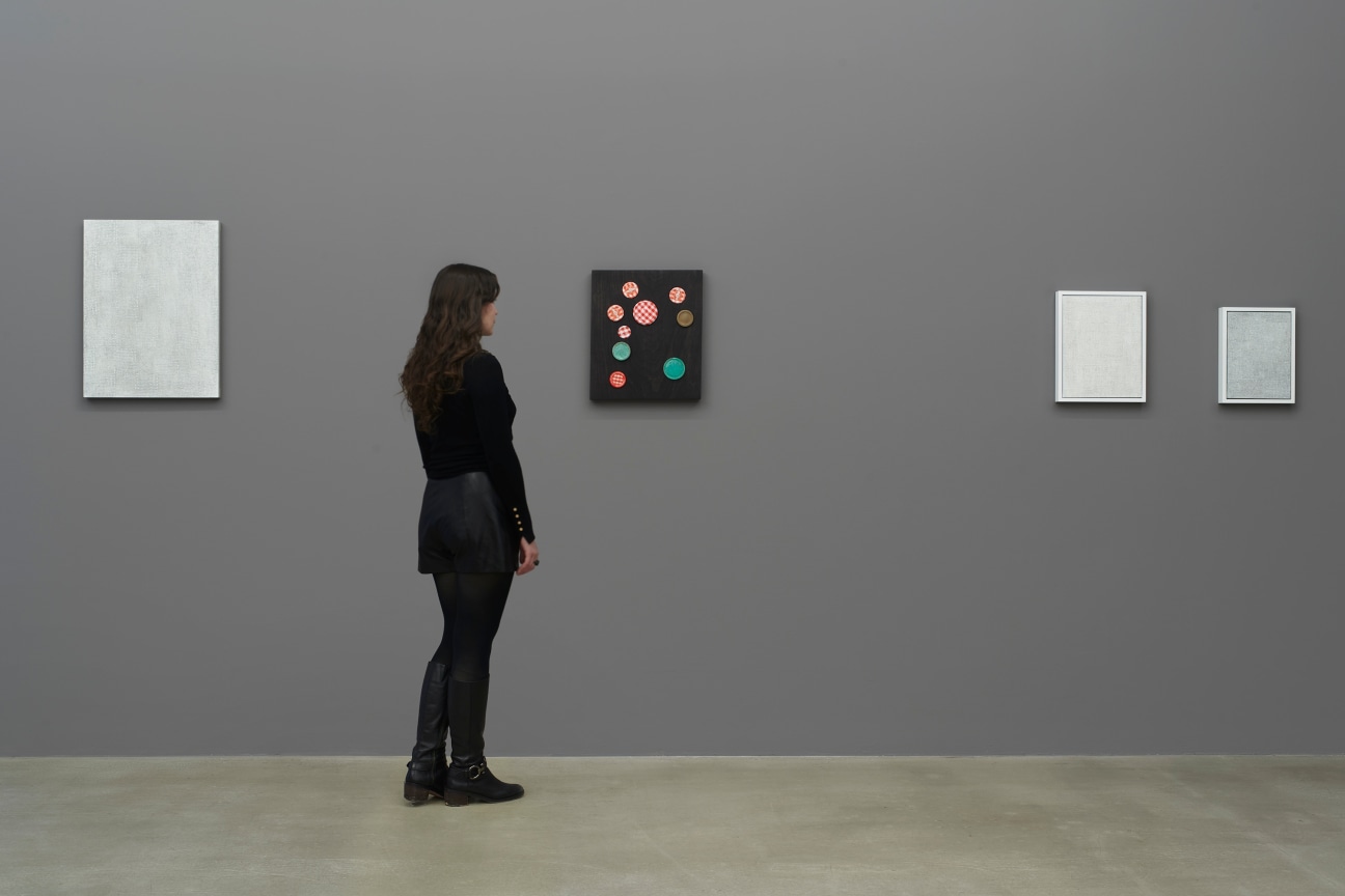 person observing a brown artwork