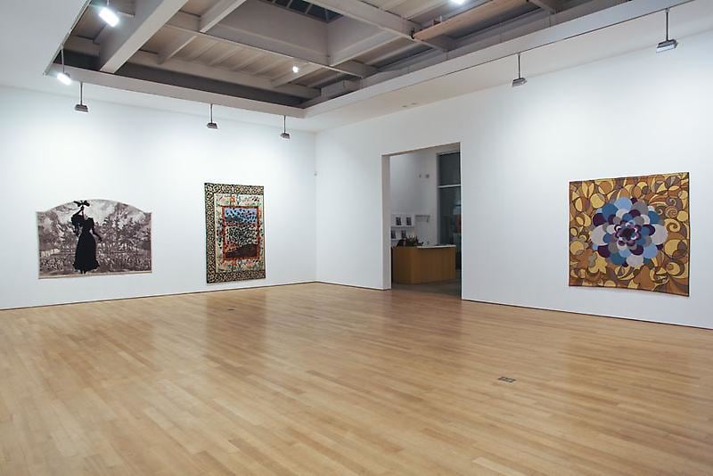 installation view of three tapestries