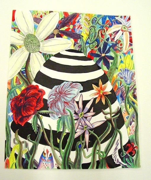 striped mound surrounded by flowers