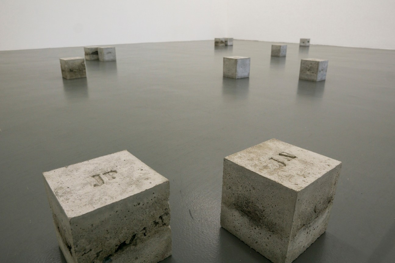 Inscriptions on cement blocks read JP