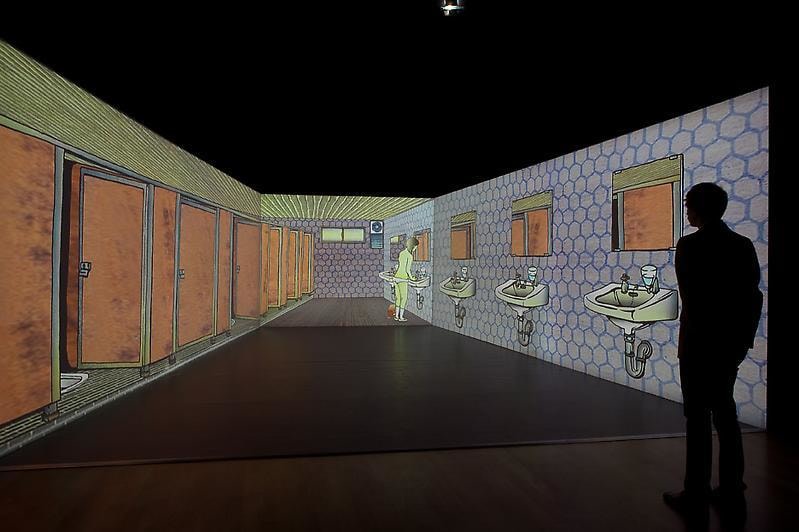 projection of an animated women's bathroom
