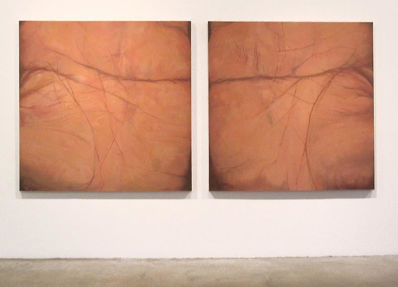 Two paintings depict closed-up details of a person's left and right palms