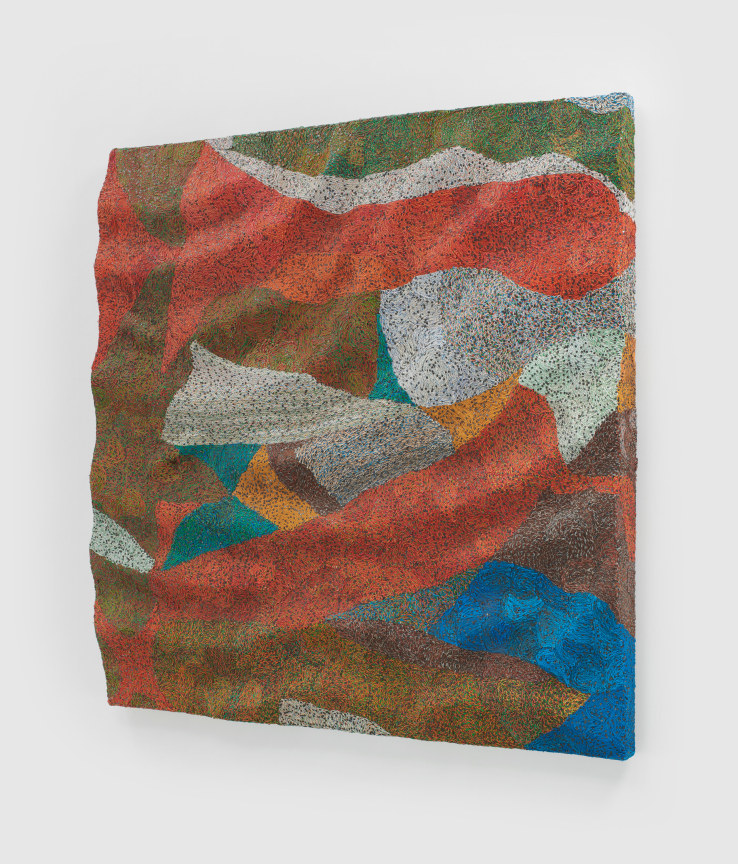 woven electrical wires that create a colorful pattern on a panel