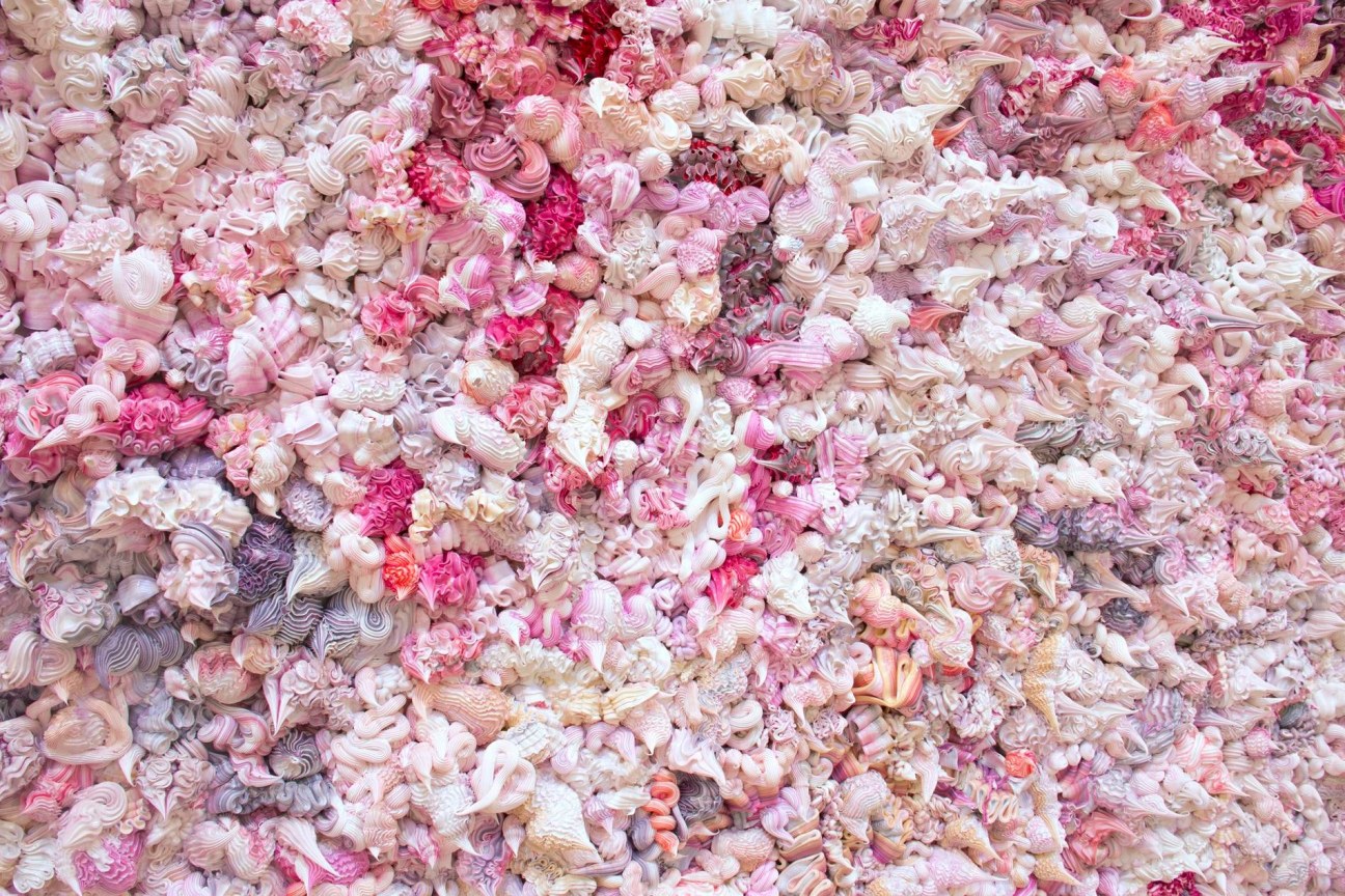 dollops of pink, purple, and white whipped cream substances packed together