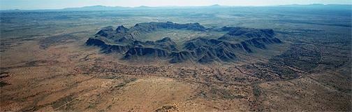 landscape photograph of a meteorite crater