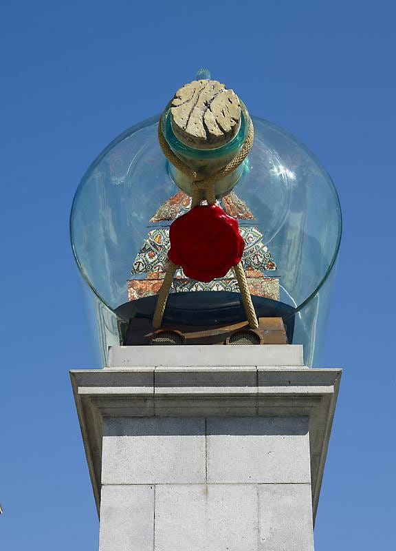 frontal view of a giant bottle containing a ship