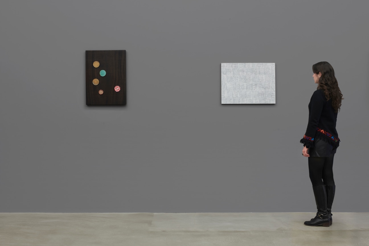 person observing a white artwork