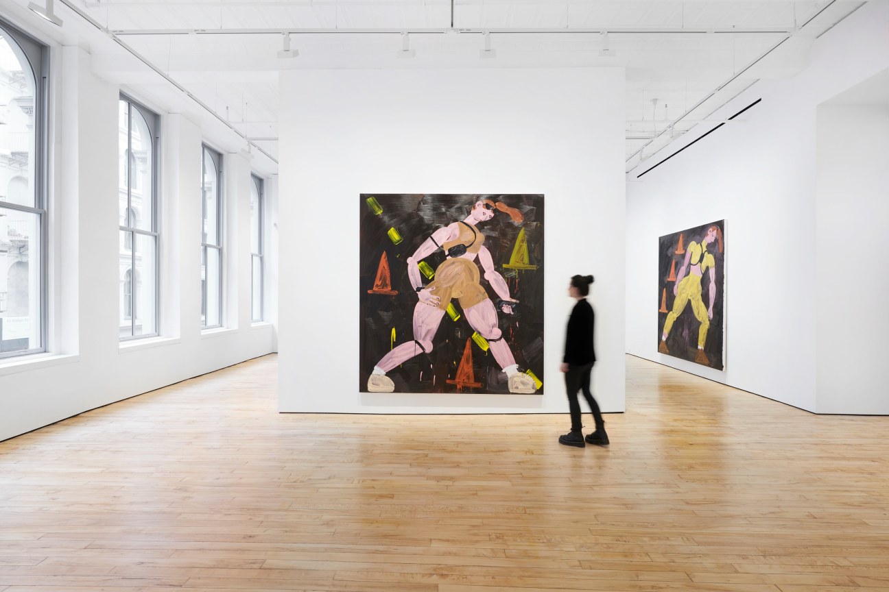 person walking towards a painting