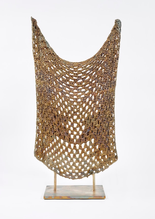 Bronze sculpture shaped like a knitted quilt