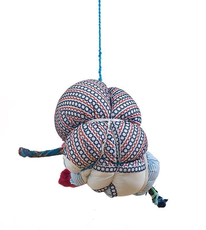 bundle of cloth hanging from the ceiling