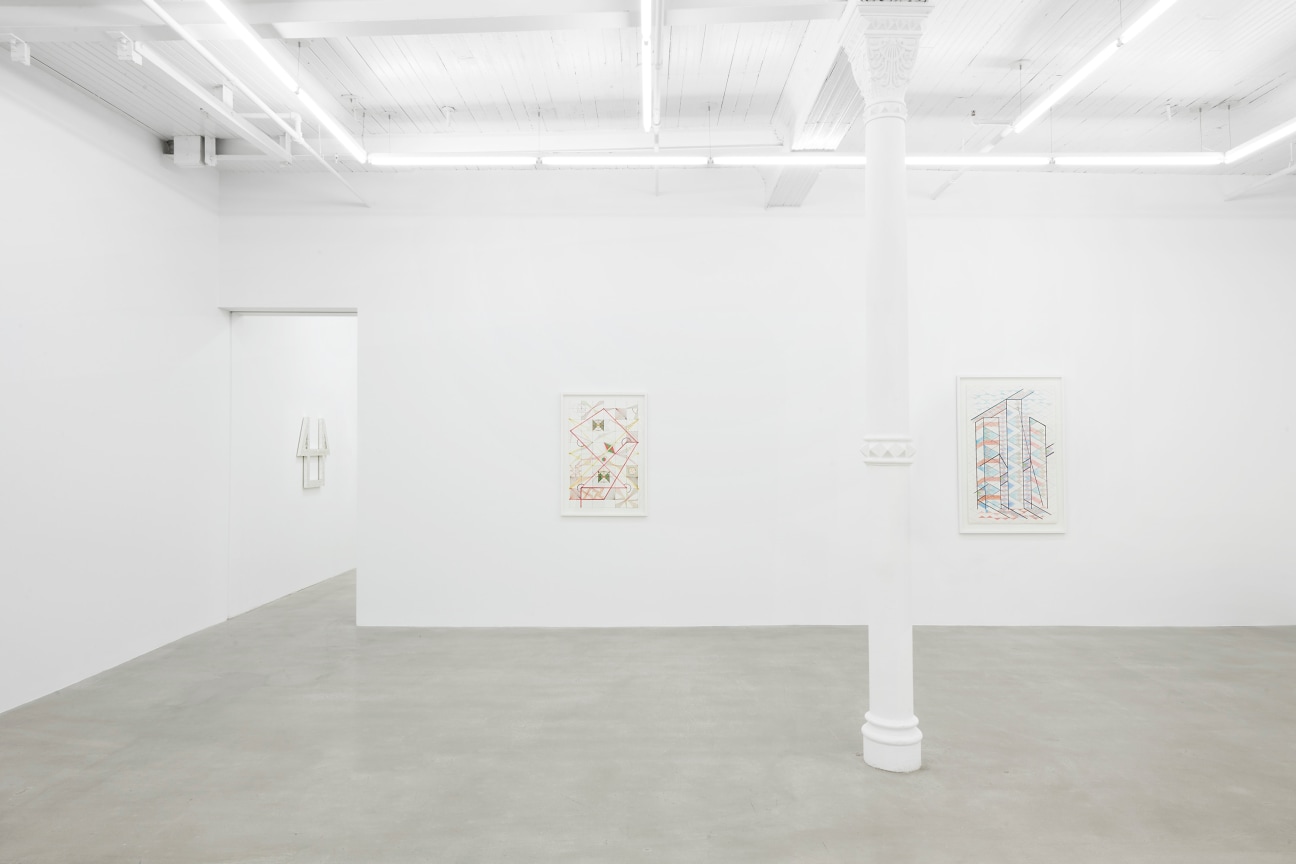 gallery view of two artworks with a doorway to the left leading to another room