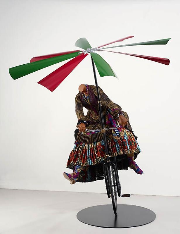 headless mannequin riding a flying machine