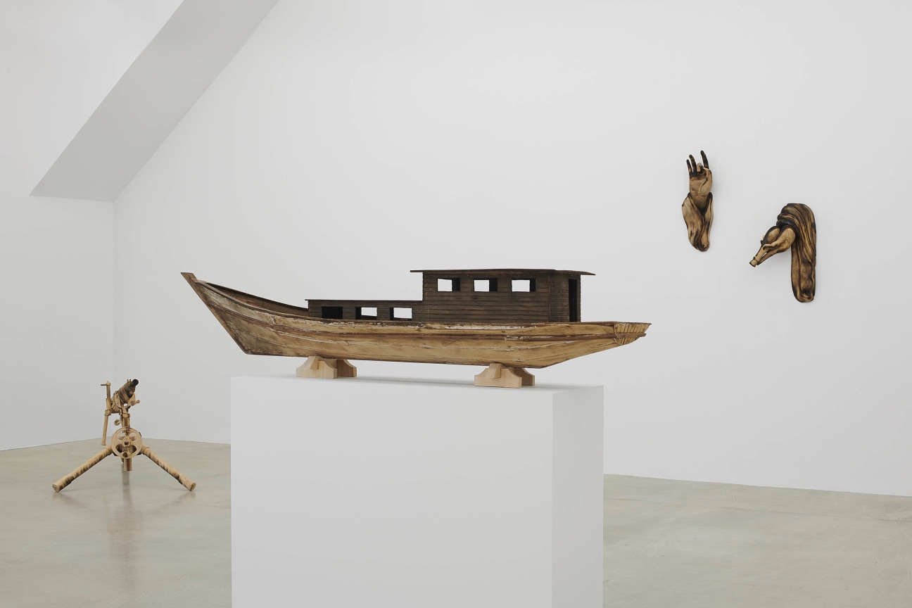 view of Tuan Andrew Nguyen's &quot;A Lotus in a Sea of Fire&quot; exhibition focusing on three wooden sculptures