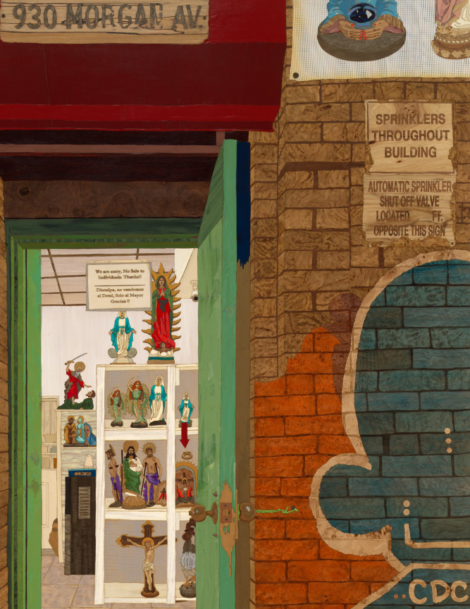 a graffitied building with a door that leads into a store of religious objects