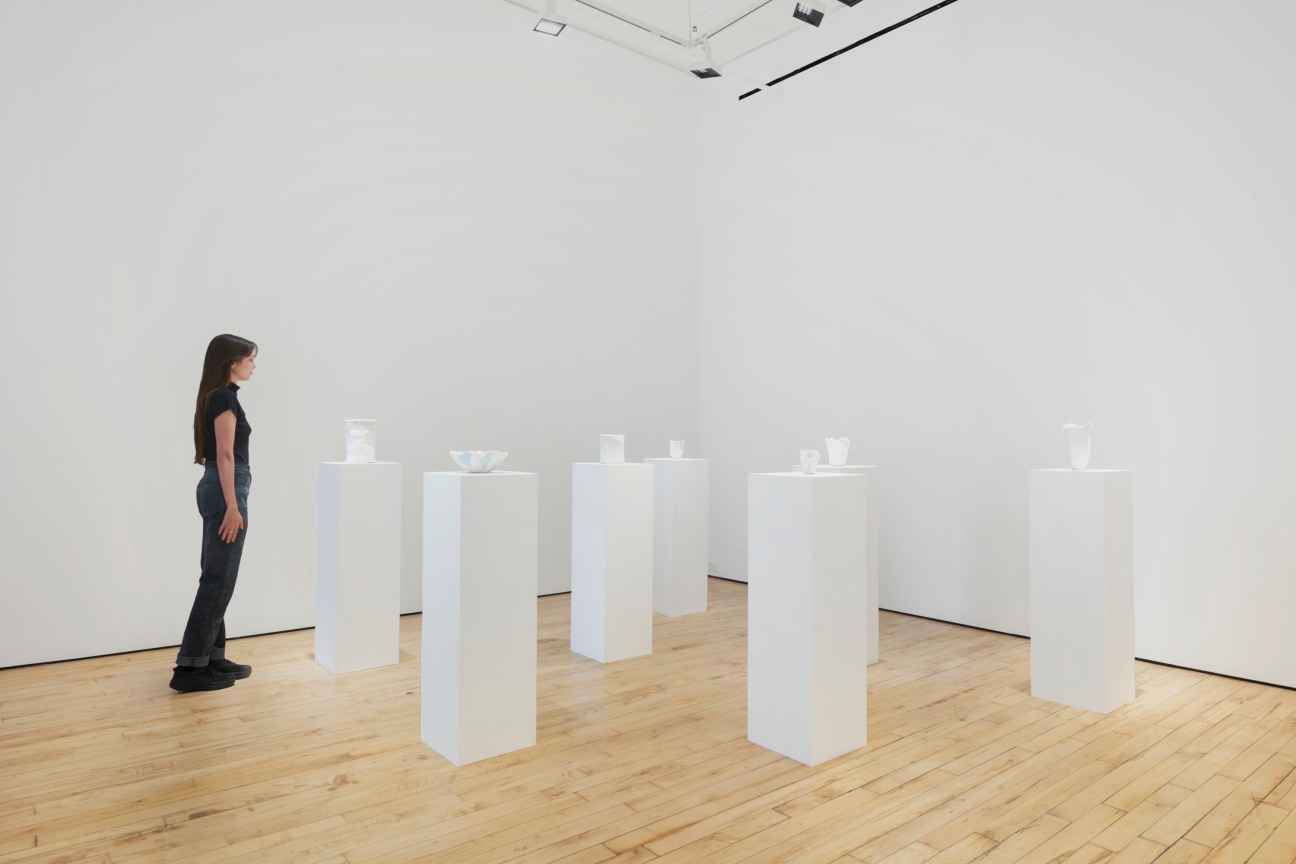 several small sculptures on pedestals