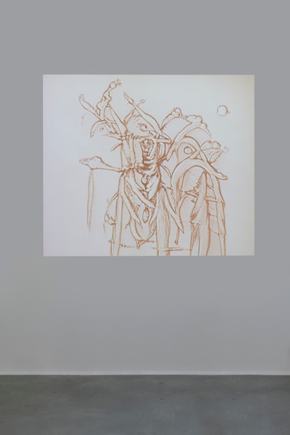 photograph of a flickering sepia-toned video projection on a wall of a digital animation work by Matthew Ritchie created with GANS technology resembling a blooming outer space flower or creature