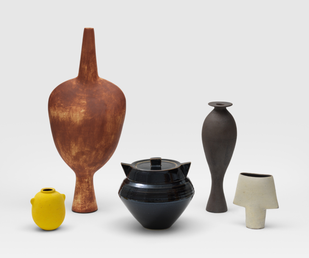 WAYNE NGAN, L-R: Yellow Vase with Lugs,&nbsp;2016,&nbsp;Rust Coloured Vase,&nbsp;2017,&nbsp;Yukon Black Jar with Geometric Lugs,&nbsp;c. 2000s,&nbsp;Thin Vase with Cast Iron Glaze,&nbsp;2014,&nbsp;White Vase,&nbsp;2016.