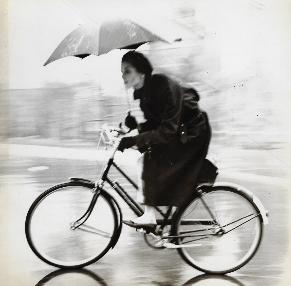Tom Palumbo, Anne St. Marie on a Bike with Umbrella, circa 1956