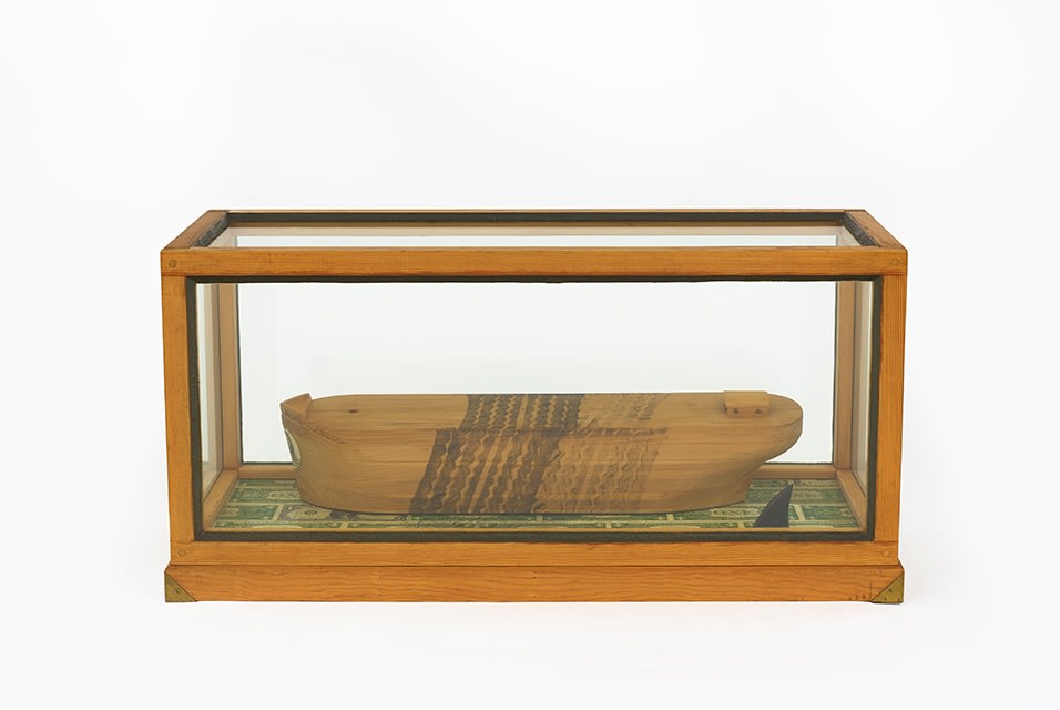 H.C. Westermann, Death Ship Runover by a &#039;66 Lincoln Continental, 1966. Pine, plate glass, ebony, US dollar bills, putty, brass, ink, 15 5/8 x 32 1/2 x 11 3/4 inches, 39.7 x 82.6 x 29.8 cm.