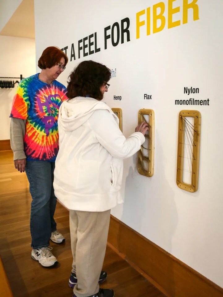 Kay Tierney of Ames and JoAnn Masterson of Des Moines get a feel for the fibers used in the exhibits at the Des Moines Art Center.&nbsp;Rodney White/The Register.