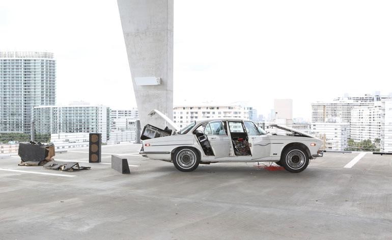 &#039;Welfare Mothers Make Better Lovers&#039;, by Dan Colen and Nate Lowman, 2008, comprises a refashioned 1973 Jaguar. The car park itself was designed by architects Herzog &amp;amp; de Meuron