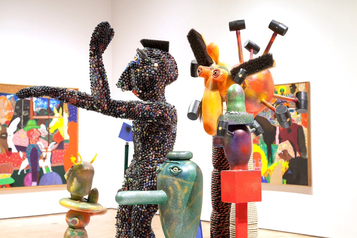 Installation image of the exhibition titled Of Dogs and Other People: The Art of Roy de Forest at the Oakland Museum of California in 2017