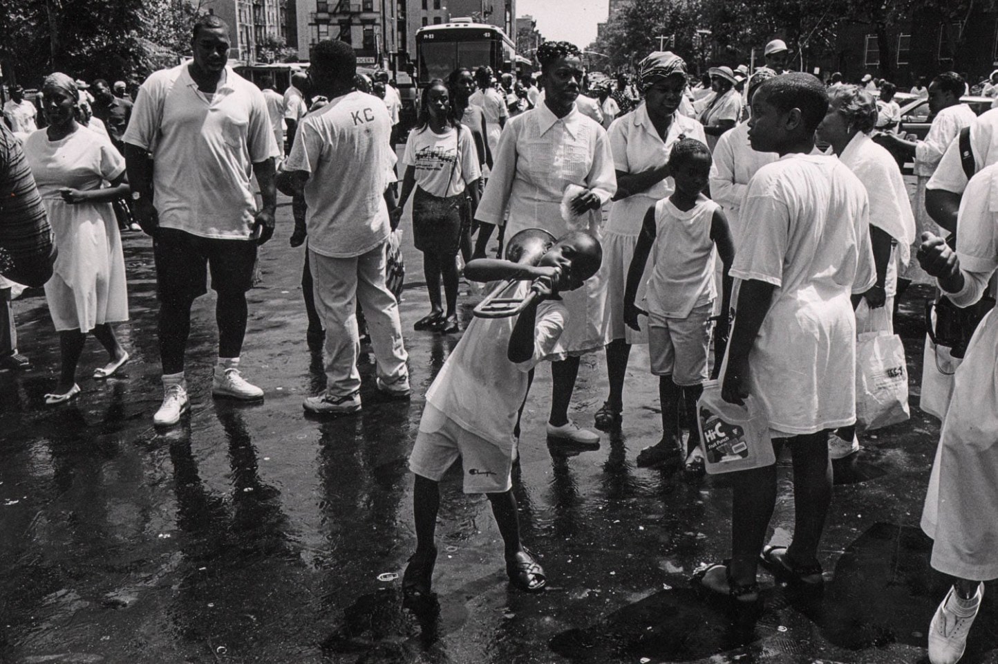 42.&nbsp;OZIER MUHAMMAD (American, b. 1950), Boy Bends Notes on a Broken Trombone, Harlem, 1994