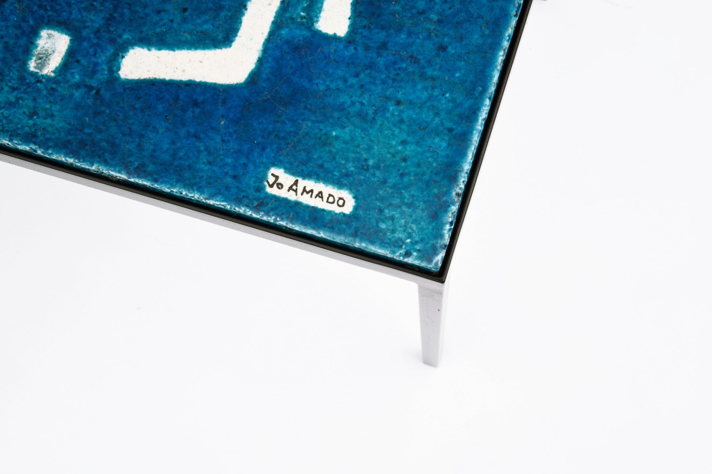 Jean Amado's ceramic coffee table signature detail