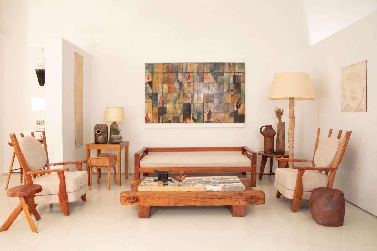 Installation view of exhibition. Pieces from left to right Guillerme et Chamrbon's pair of &quot;Tapisserie&quot; armchairs, Pierre Chapo's &quot;S31A&quot; stool, Ilina Horning's wool tapestry, Henry Jacques Le M&ecirc;me's side table, Louis Sognot's foot rest/stool, Yves Mohy's ceramic vase, Marius Bessone's bowl, La Borne's table lamp, Pierre Chapo's &quot;L06A&quot; daybed, Paul Becker's coffee table, Marcel Ducos' ceramic panel, French 1970s sculptural tidy, Ren&eacute; Gabriel side table, La Borne ceramic pitcher, Yves Mohy's ceramic vase, Pierre Blanc's floor lamp, Annie Fourmanoir's stool, and Aline Gagnaire painting