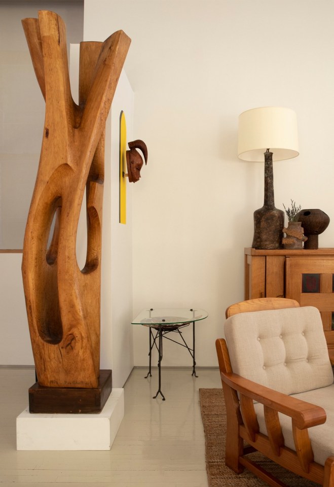 Installation view of exhibition. Pieces from left to right are Paul de Ghellinck's large sculpture, Ren&eacute; Buthaud's ceramic mask, Les Archanges ceramic and glass side table, Maison Regain's armchair, R. Vigeant's large lamp, Alain Girel's ceramic vase, French 1960/70s table lamp