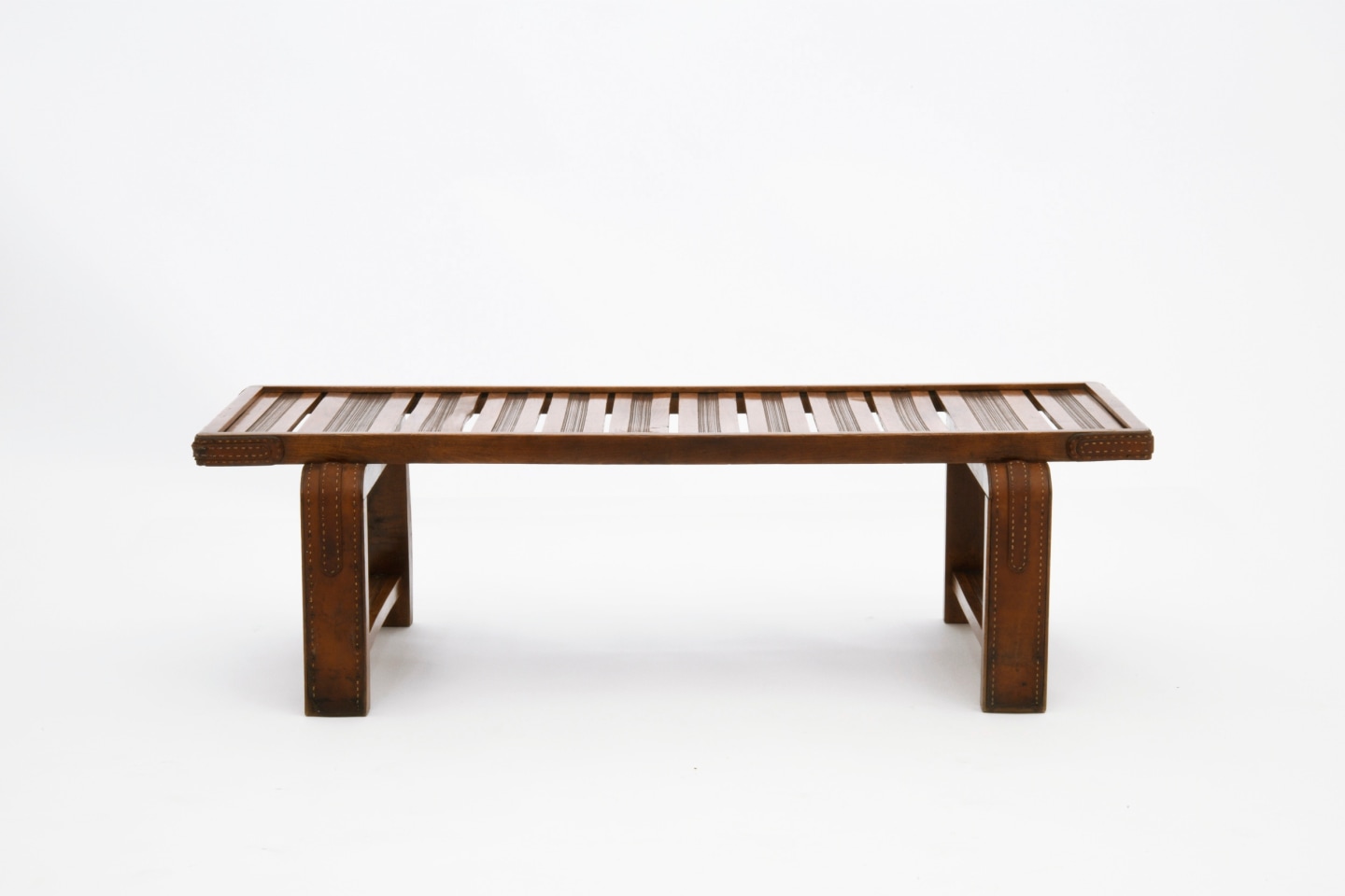 Jacques Adnet's coffee table/bench straight view