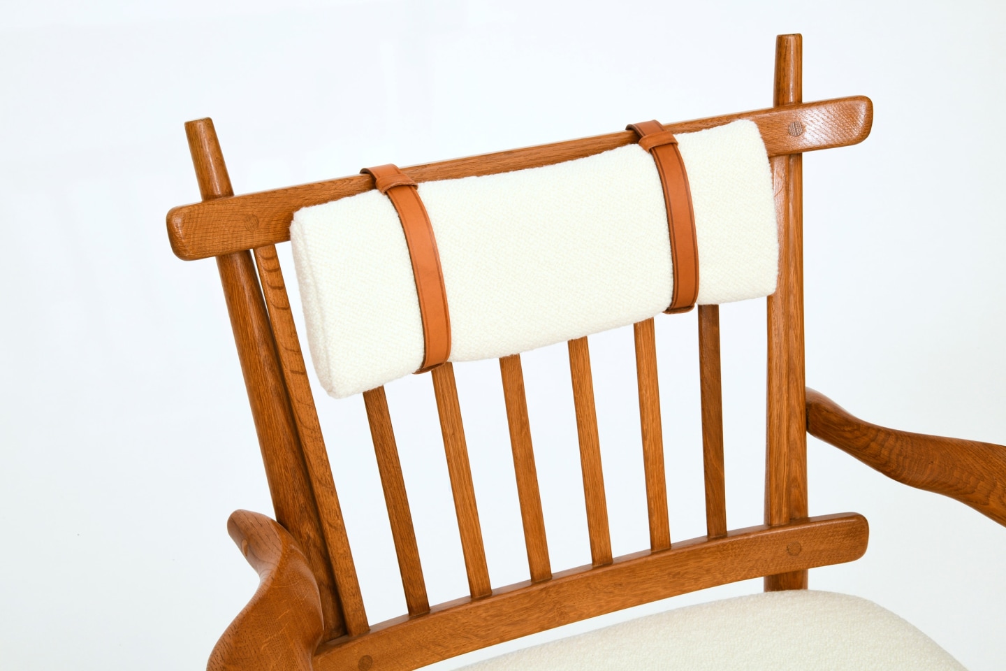 Guillerme et Chambron's pair of armchairs, detailed view of top cushion and wooden frame