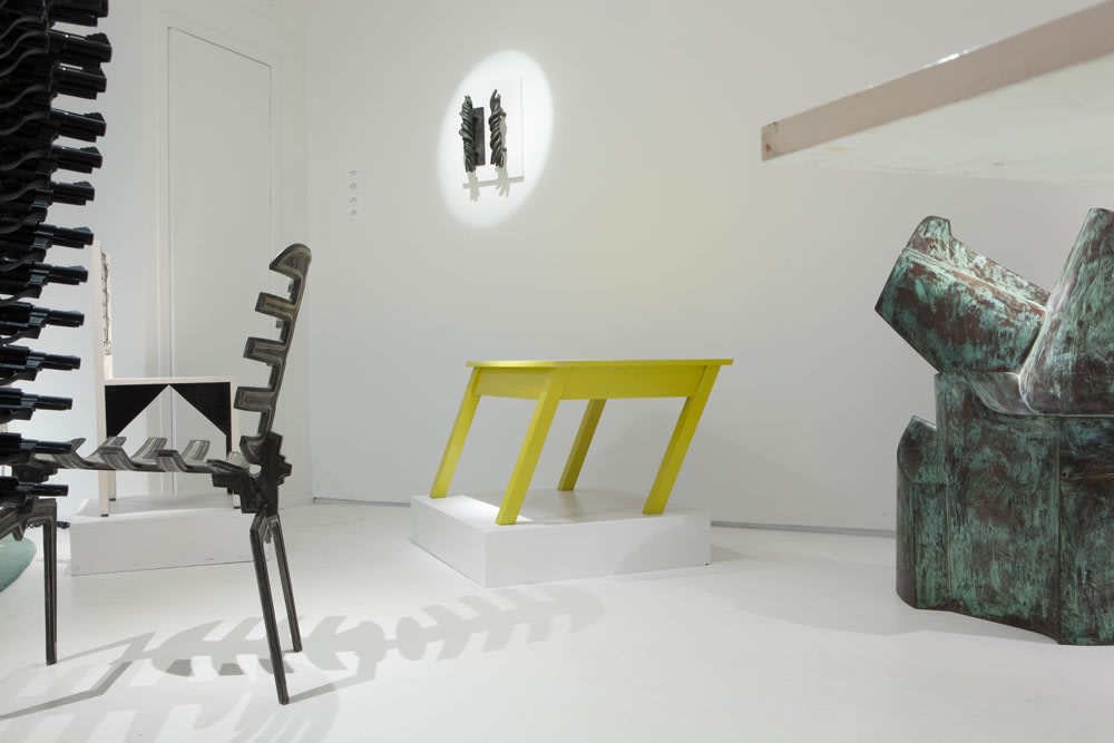 Art et Industrie exhibition installation view: Pieces from left to right are Terence Main's Frond chair 7, Michele Oka Doner's door handles, Rafael Barrios' Mesa table, and Jim Cole's Dorset Marker