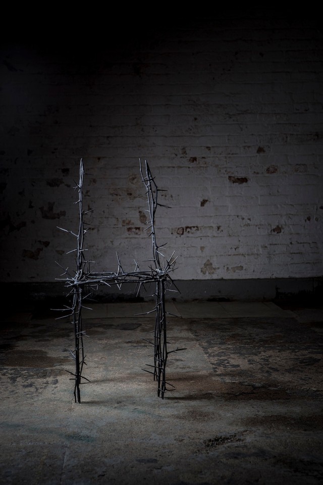 Michele Oka Doner's Terrible Chair, full straight view in a darker warehouse setting