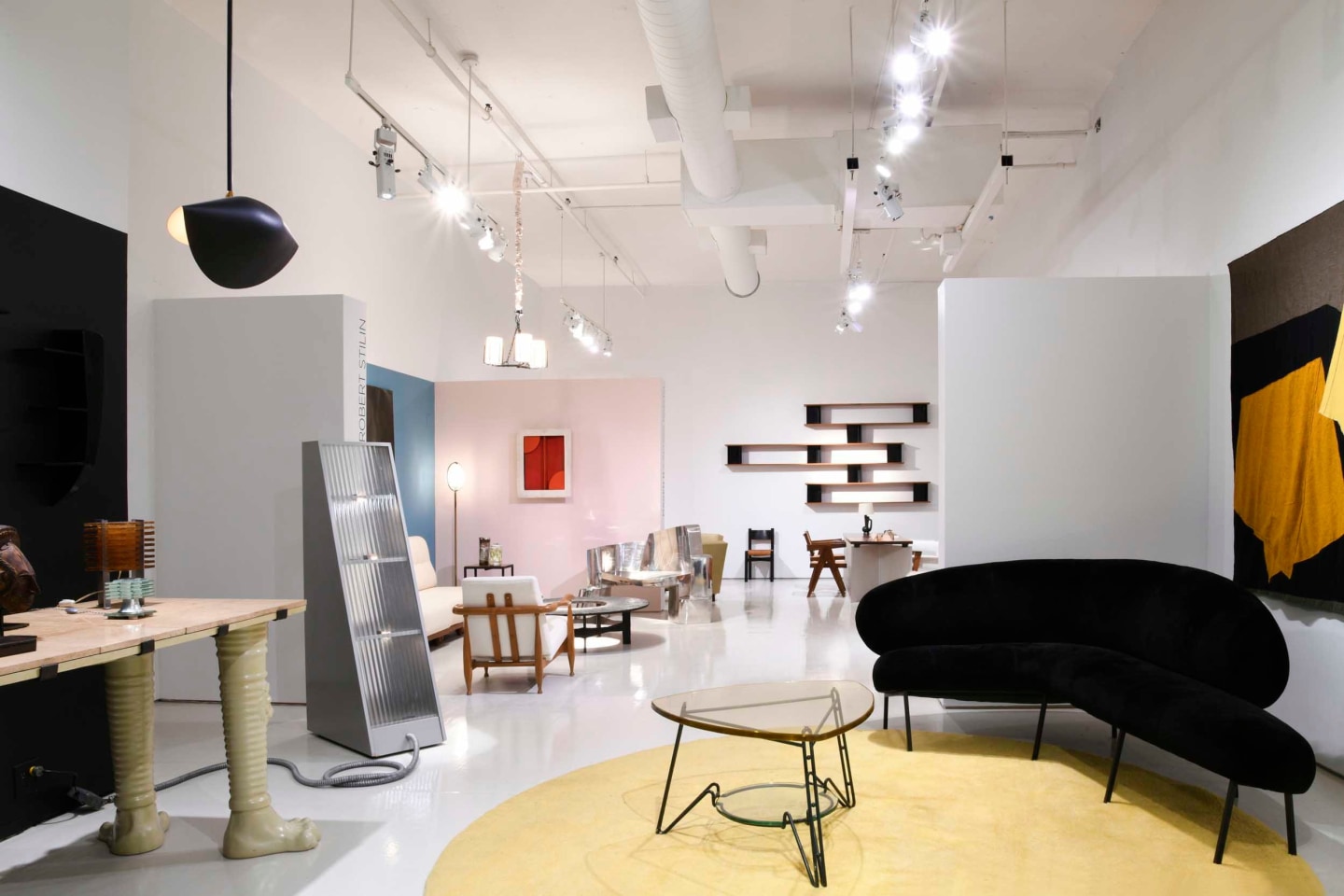 Full view of all three curated rooms in gallery