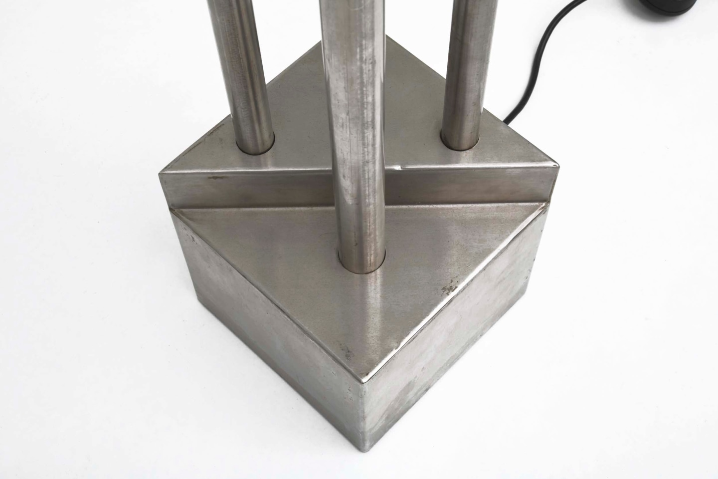 Magnousson's pair of floor lamps, detailed view of metal base