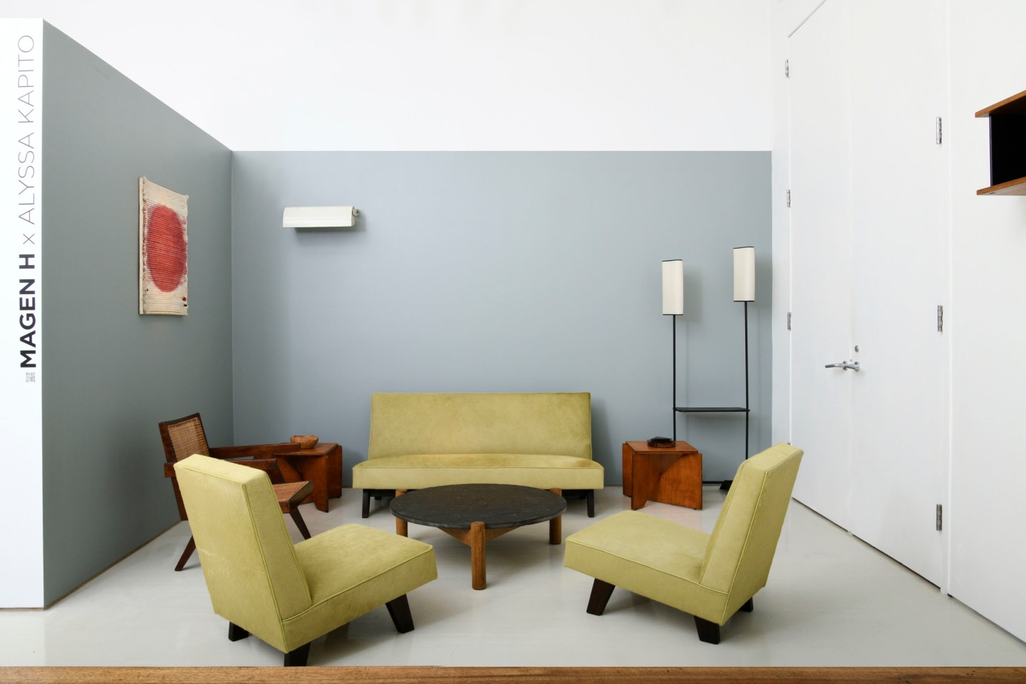 Alyssa Kapito's room | Pieces from left to right are Vera Cardot's &quot;Soleil Rouge&quot; painting (1971), Pierre Jeanneret's office chair (c. 1955-56), Le Corbusier's &quot;LCII&quot; sconce (1949-52), Alexandre Noll's wooden bowl (c. 1950), Le Corbusier, Pierre Jeanneret &amp; Jeet Lal Malhotra's &quot;Chief Justice&quot; three-piece suite (1955), Charlotte Perriand's coffee table (c. 1950), Herv&eacute; Baley's stool/side table (c. 1970), Alexandre Noll's cigarette box (1950), French floor lamp (c. 1950)