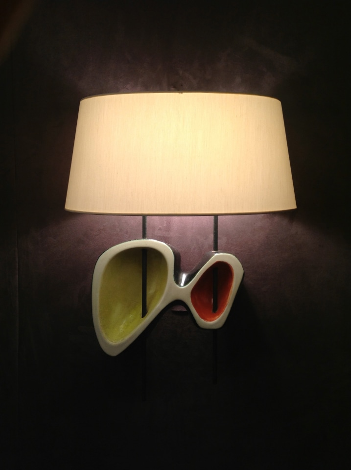 Magen H Gallery's booth at Winter Antiques Show, install image of Georges Jouve's &quot;tete de boeuf&quot; wall sconce