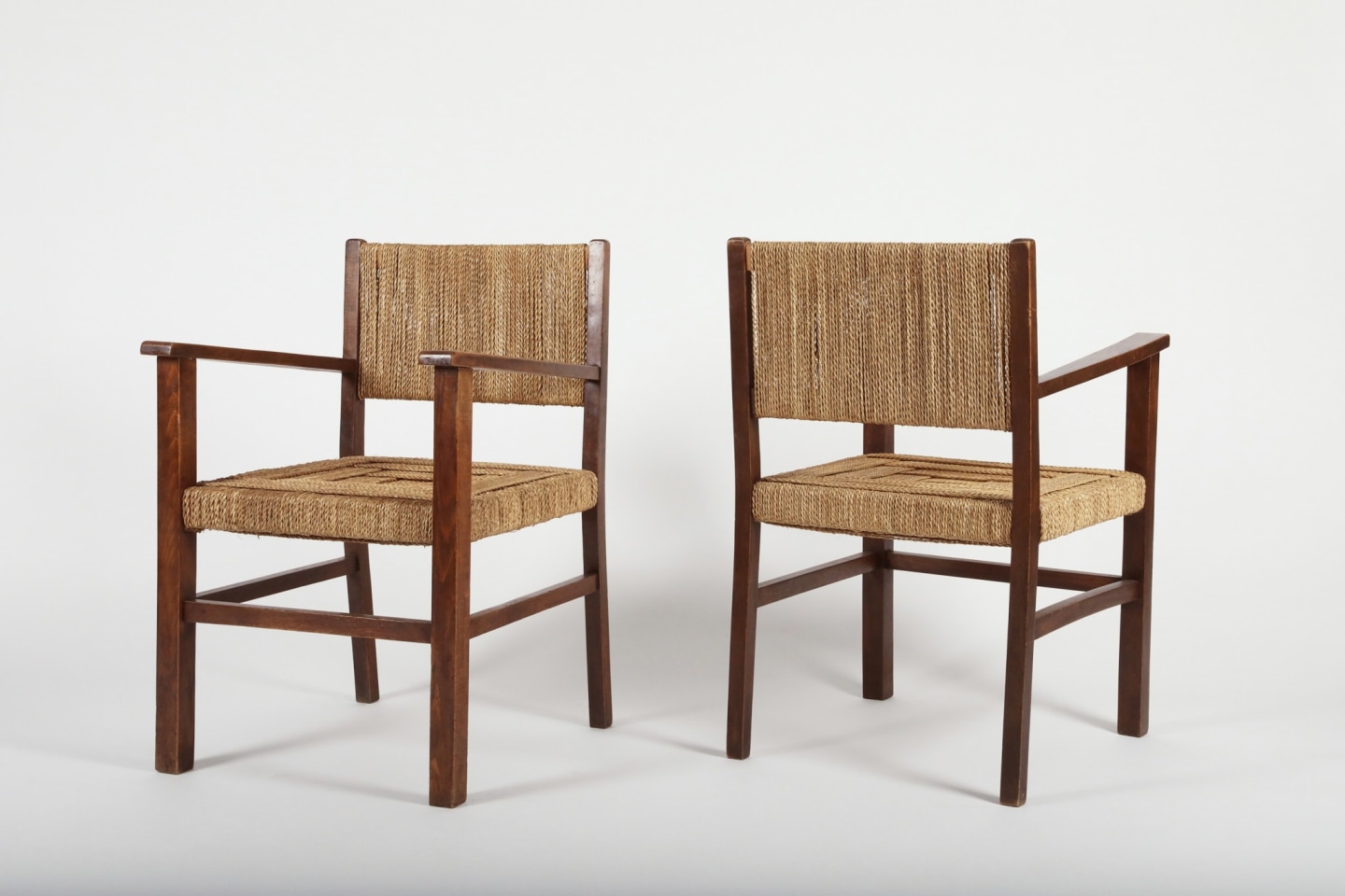 Francis Jourdain (1876 - 1958) Pair of armchairs, 1930 _View of both chairs. One facing forward and one facing backward