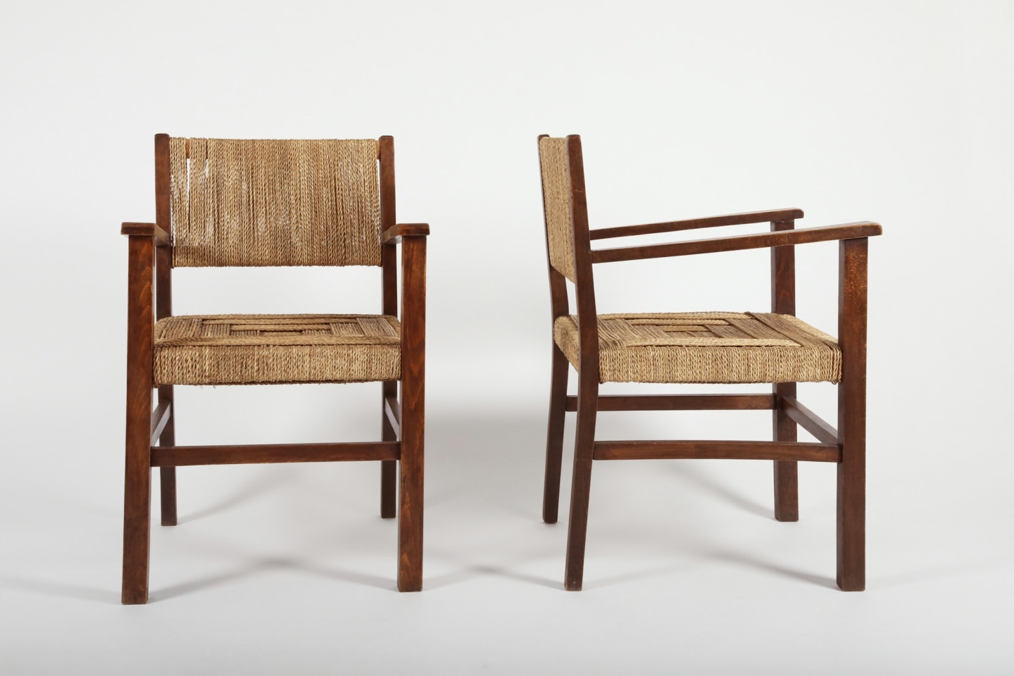 Francis Jourdain (1876 - 1958) Pair of armchairs, 1930 _View of both chairs. One facing perpendicular to the other.