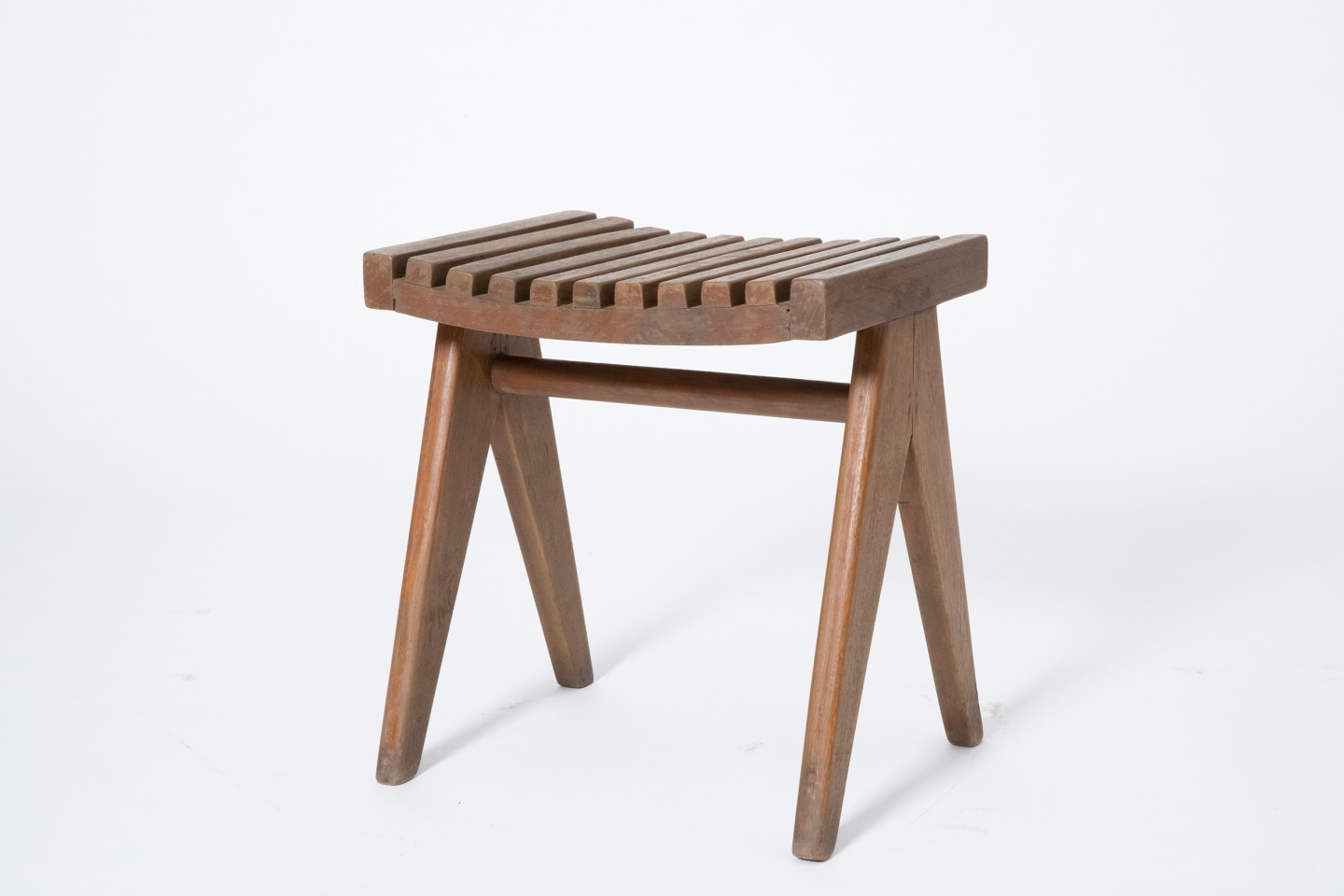 Pierre Jeanneret's pair of stools, full diagonal view of single stool