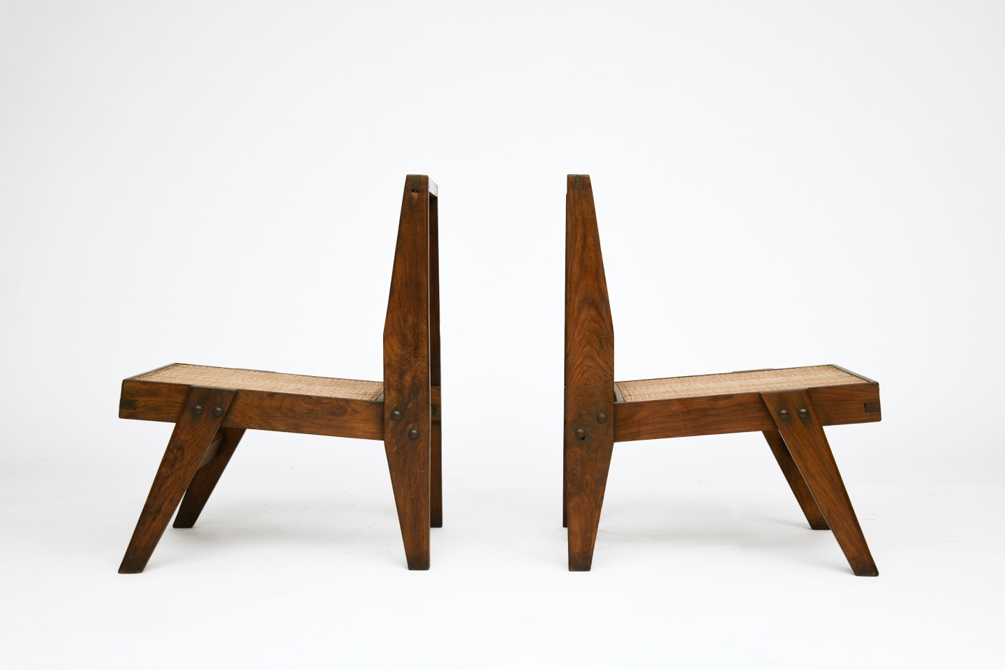 Pierre Jeanneret's pair of low chairs, both side views