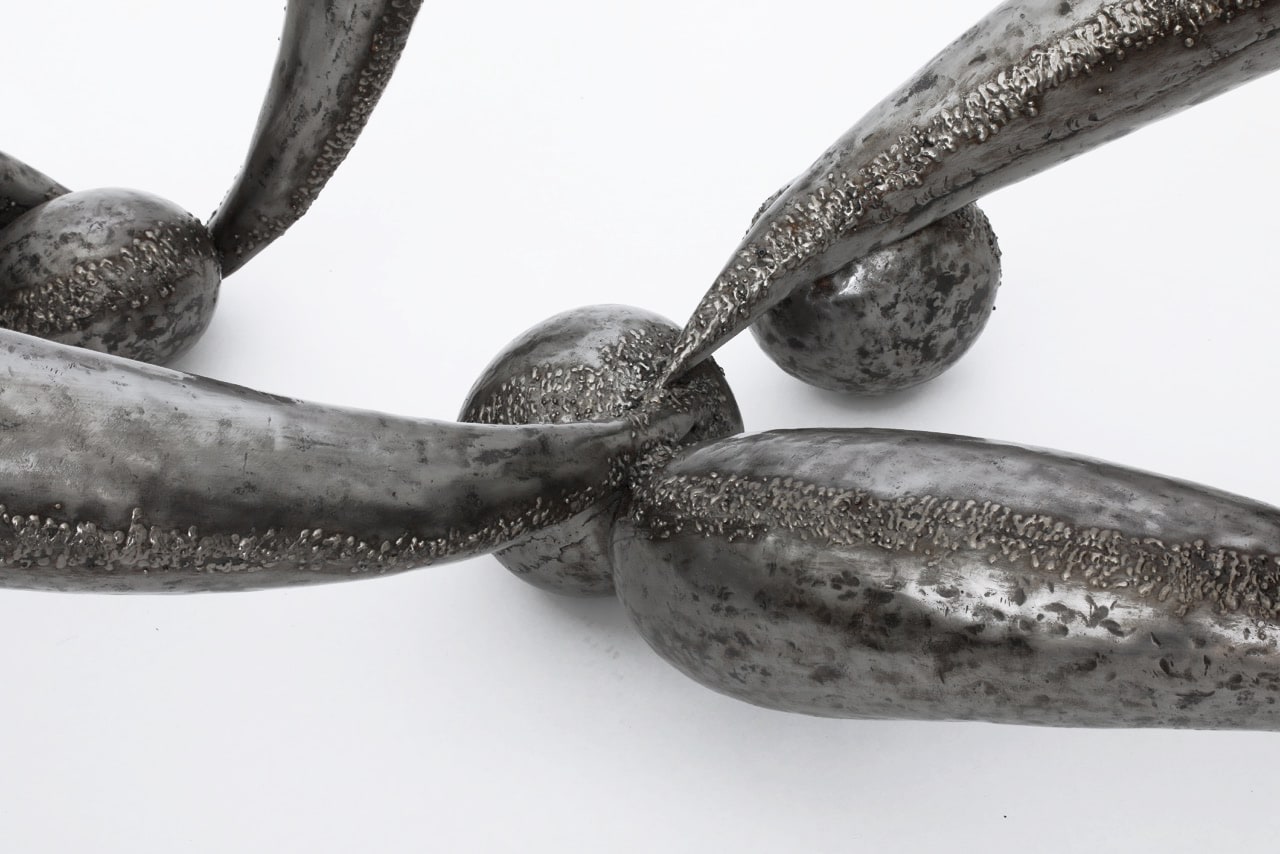 Ren&eacute; Broissand's sculptural coffee table detail view of iron legs